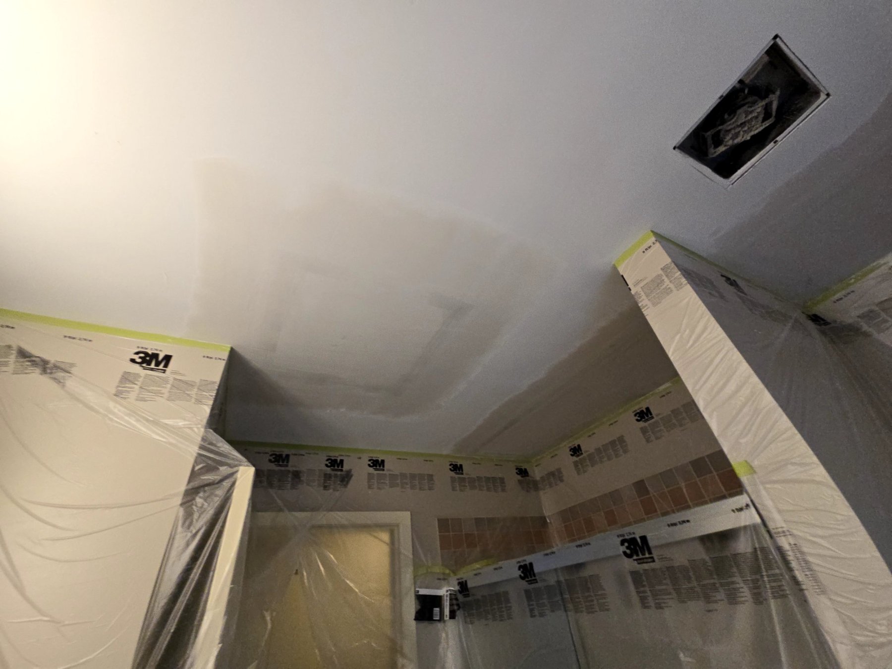 Ceiling opening from a Poly-B repipe, protected and ready for patching