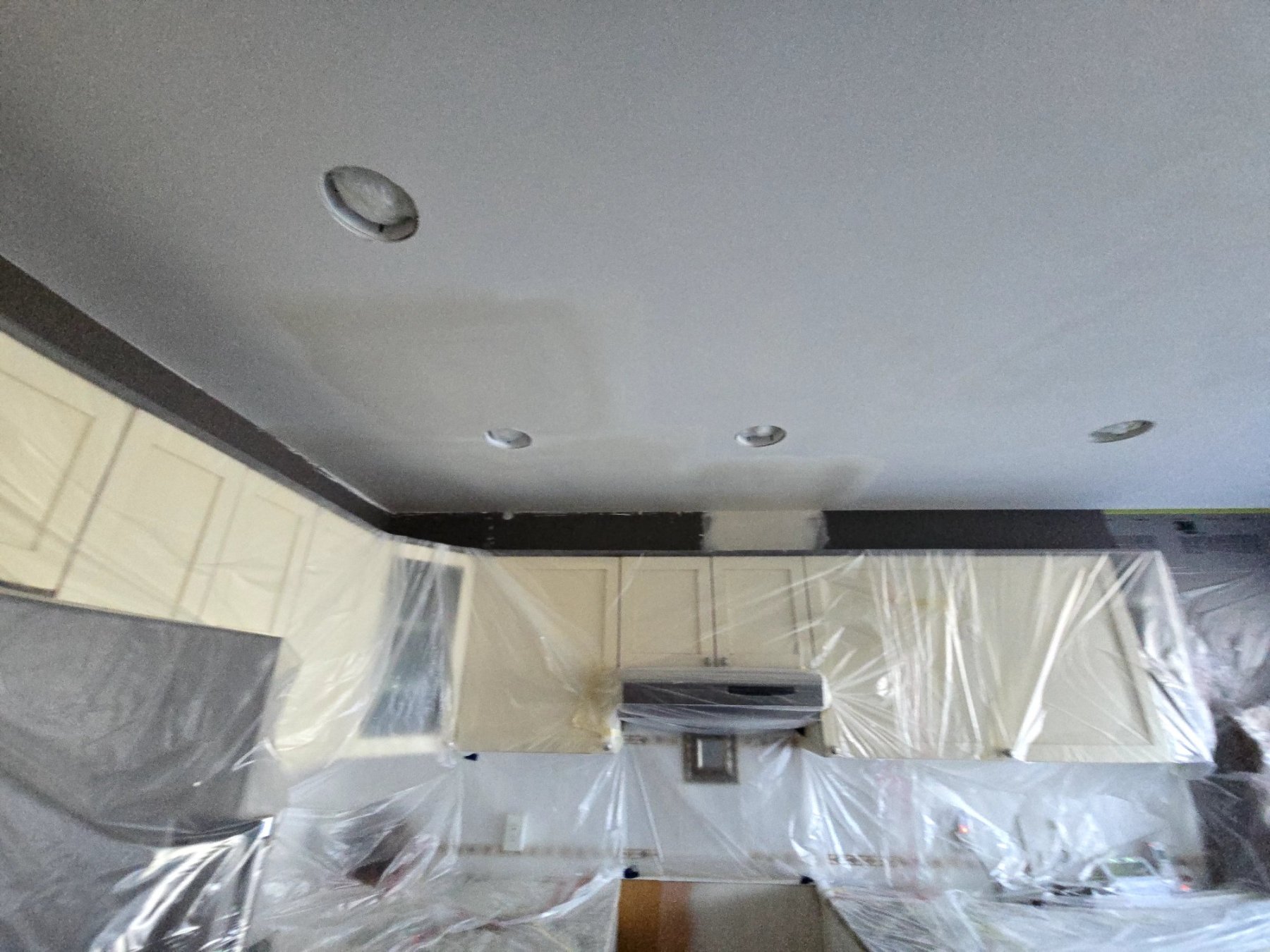Kitchen protected and ceiling patched during Poly-B restoration